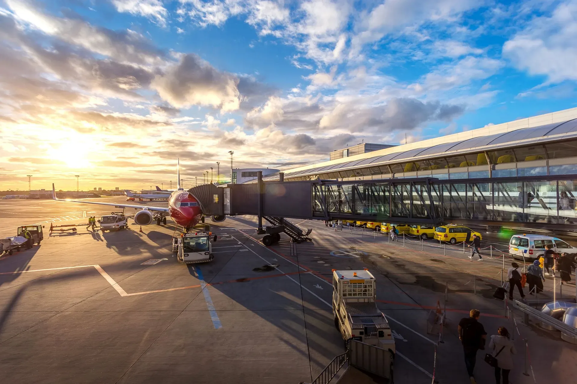 Airport terminal and apron infrastructure at sunrise